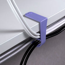  Purple cable clip attached to desk Dino clip cable organization simple