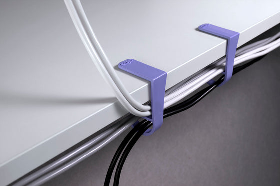 Attach purple cable clips to desk Dino clip cable organization simple